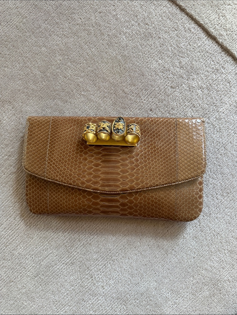 Women’s Brown Python-Texture Clutch with Gold Knuckle Detail